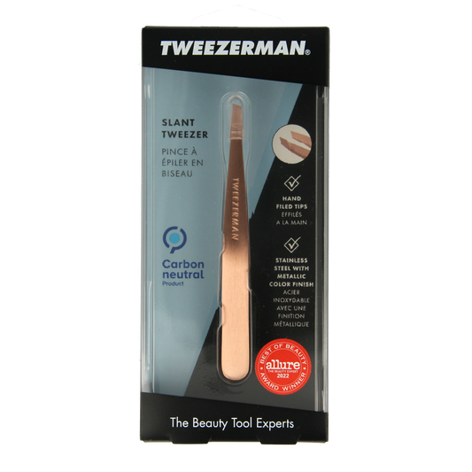 Tweezerman Slant tweezer in rose gold with stainless steel construction, designed for precise eyebrow grooming.
