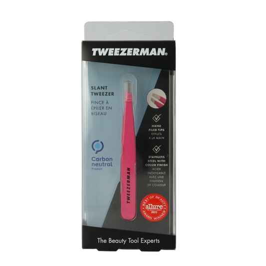 Tweezerman Slant pink stainless steel tweezers, precision grooming tool, close-up view of the Tweezerman brand product.