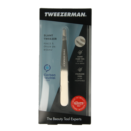 Tweezerman Slant stainless steel tweezer for precise eyebrow grooming, shown in a close-up image.