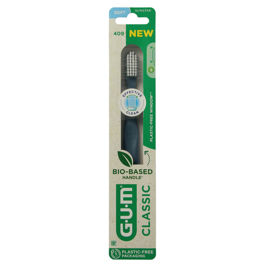 GUM Classic Soft toothbrush with medium-sized head, showing bristles and handle for effective dental cleaning.