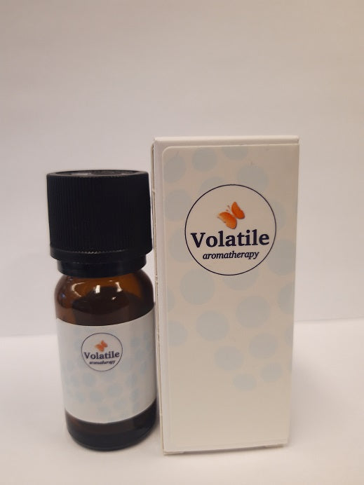 Volatile Zielenrust essential oil bottle, 10ml, natural herbal aroma from Volatile, with green herbal plant in background
