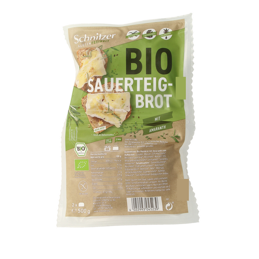 Schnitzer Rustico Amaranth gluten-free organic bread loaf, 500g, with a rustic crust and sliced texture on a wooden surface.