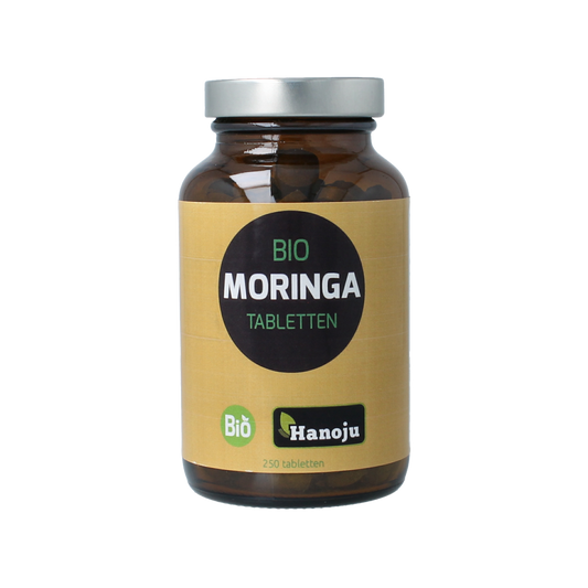 Hanoju Moringa bladpoeder supplement in 500mg tablets, natural herbal preparation with green moringa leaf powder.