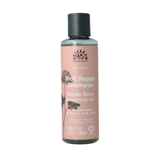 Urtekram Nordic Berry Powder Shampoo for hair care, 250ml, with vibrant berry ingredients in a clear bottle.