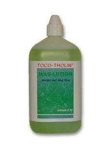 Toco Tholin Waslotion 1 liter bottle, a body care product with a white pump dispenser and clear liquid inside.