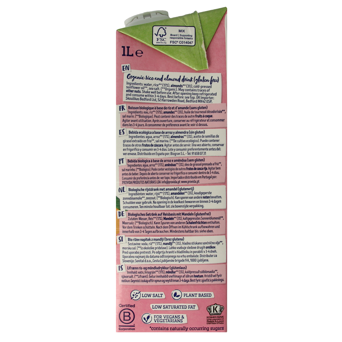 Glass of Isola Bio organic almond rice drink in a 1-liter bottle, showcasing the beverage's creamy texture and packaging.