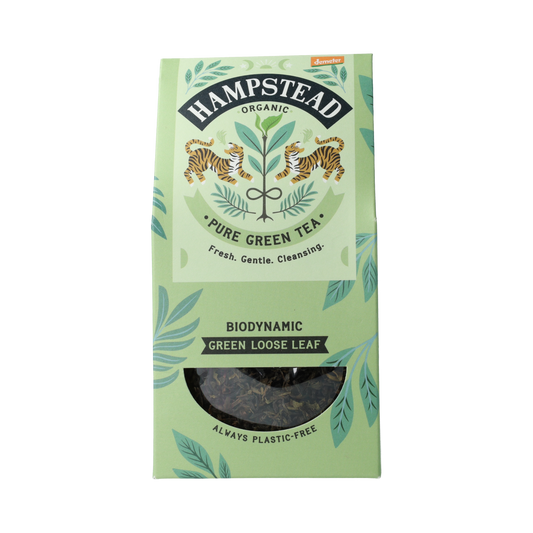 Hampstead organic green loose tea in a 100g package, featuring fresh, vibrant green tea leaves for brewing.