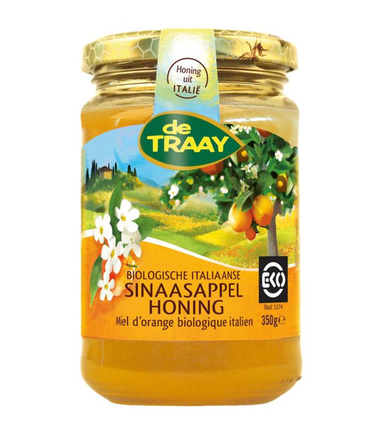 De Traay organic orange blossom honey jar labeled "Sinaasappelhoning" with a golden honey inside, 350 grams.