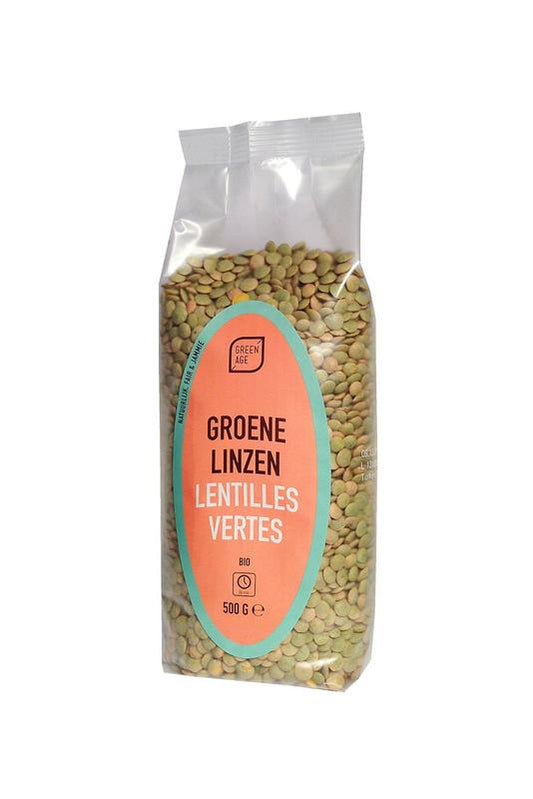 Greenage organic green lentils in a 500g package, fresh and clean, with dried green lentils spilling out on a white surface.