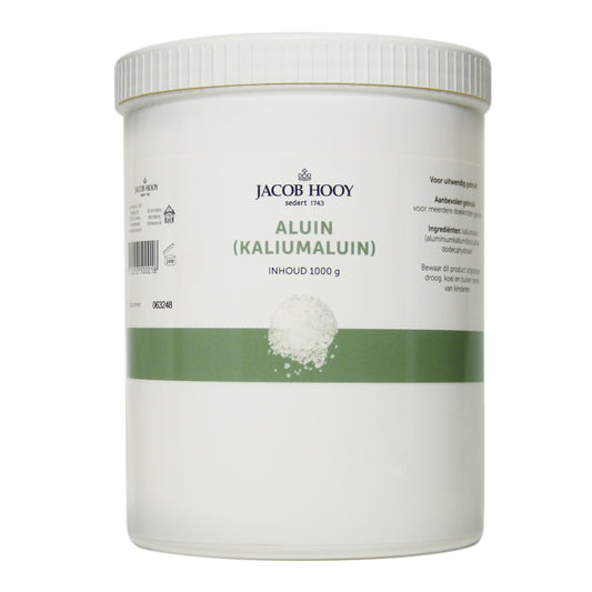 Jacob Hooy Aluin mineral crystal salt in a 1kg plastic pot, showing the white crystalline salt used for culinary and health purposes.