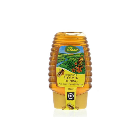 De Traay Bloemenhoning knijpfles bio, 365g jar with golden honey dripping from the open lid.