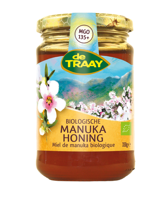 de Traay bio Manuka honey jar, 350g, with a golden honey interior and label showing natural honey product details
