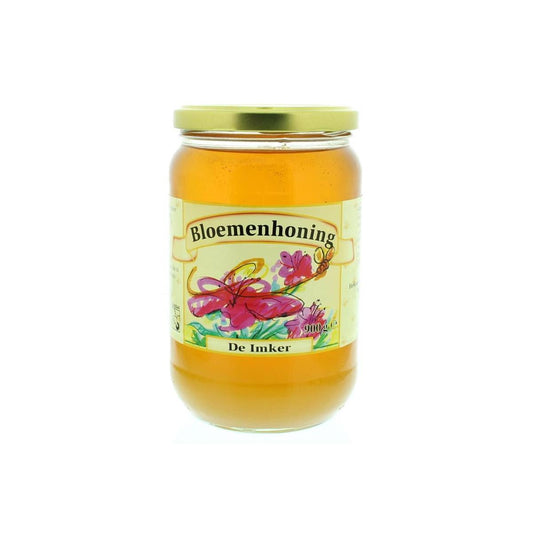 Liquid De Imker flowers honey in a 900g jar, showcasing golden, viscous honey with a smooth texture.