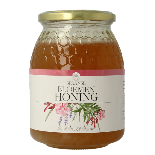 Jar of Michel Merlet Bloemenhoning spaans honey in a clear glass jar, showcasing golden, floral honey from Spain.