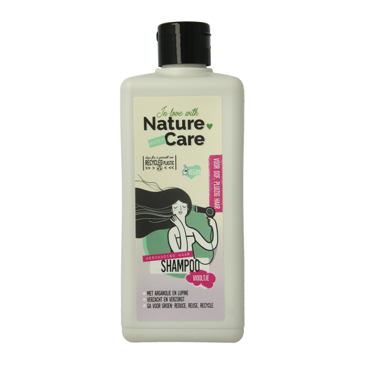 Nature Care shampoo for damaged hair in a 500ml bottle, featuring natural hair care ingredients and gentle cleansing.