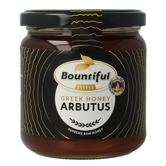 Bountiful Select Griekse rauwe honing arbutus in a 500g jar, showcasing the raw, golden honey with a natural texture.