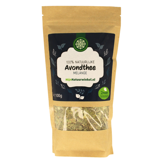 MijnNatuurwinkel Avond thee 100g in een glazen pot met thee bladeren en een theekopje, geschikt voor ontspanning en avondgebruik.
