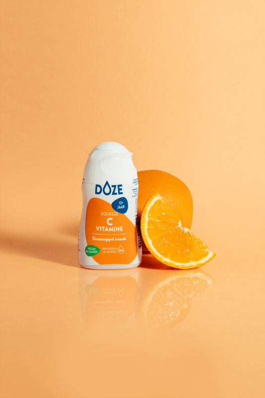 Liquid DOZE Vitamins C orange flavor in a 50ml bottle, natural vitamin supplement from DOZE Vitamins.