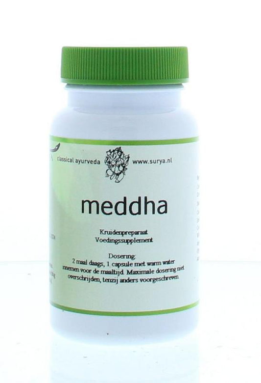 Surya Meddha Kruidenpreparaten capsules in a bottle, featuring natural herbal supplement packaging with capsules visible.