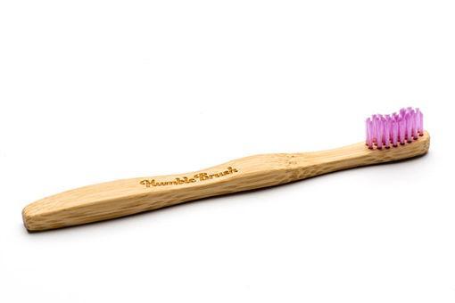 The Humble Co bamboo kids toothbrush in pink with soft bristles, designed for gentle cleaning and eco-friendly oral care.
