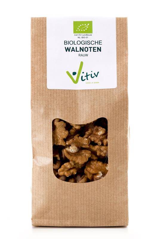 Raw organic walnuts from Vitiv, 1 kilogram package, displayed in a natural setting with fresh walnuts in a bowl and scattered on a wooden surface.