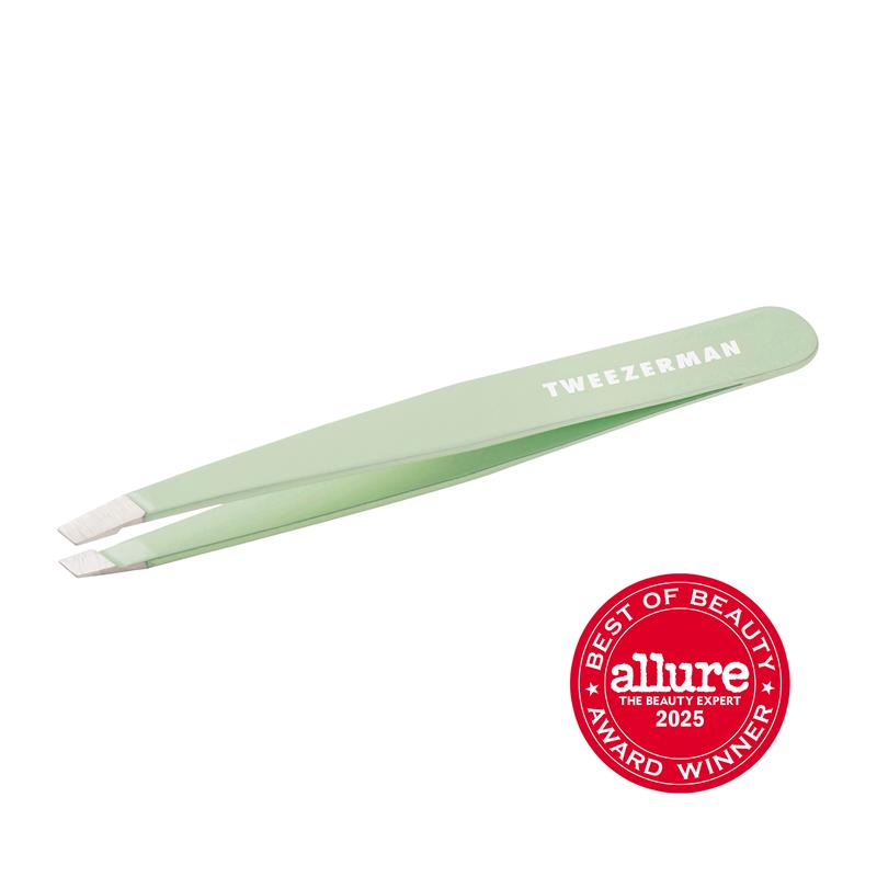 Tweezerman Slant Tweezer in pistachio green with stainless steel blades, angled tip for precise eyebrow shaping.